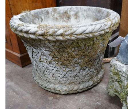 A large circular reconstituted stone garden planter, diameter 62cm, height 40cm