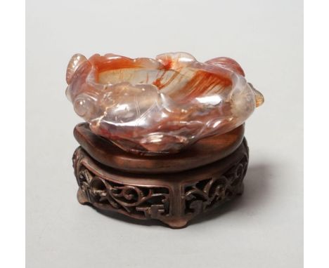 A late 19th / early 20th century Chinese agate brushwasher, wood stand - 8cm tall