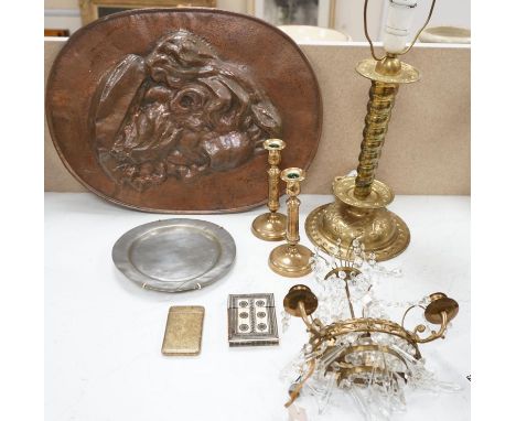 An embossed brass lamp, lustre drop wall light, a pair of bell-metal candlesticks, an 18th century pewter plate and a large S