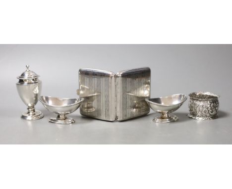 A white metal cigarette case and small silver including a pair of salts, condiment and napkin ring.