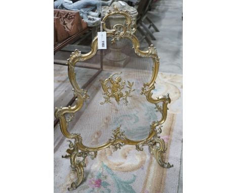 A Rococo style gilt metal mesh firescreen, width 58cm, height 82cm