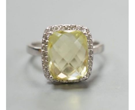 A modern 18ct white gold, fancy cut citrine and diamond cluster set dress ring, size M, gross weight 4.3 grams.