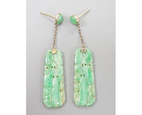 A pair of yellow metal mounted carved jade set drop earrings, overall 5cm, gross weight 7 grams.
