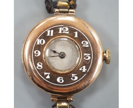 A lady's George V 9ct gold Rolex manual wind wrist watch, with Arabic chapter ring, case hallmarked for London, 1919, on a le