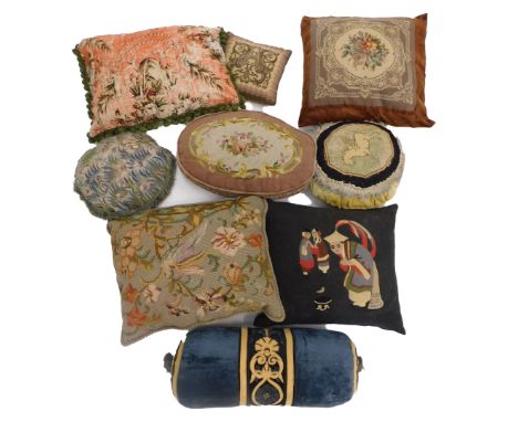 A collection of tapestry cushions, to include Pegasus and flowers and a velvet bolster. (8)