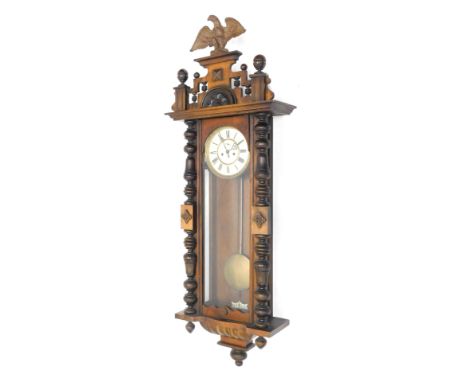 A late 19thC Gustav Becker walnut cased double weight Vienna clock, of large proportion, with eagle finial, raised above 18cm