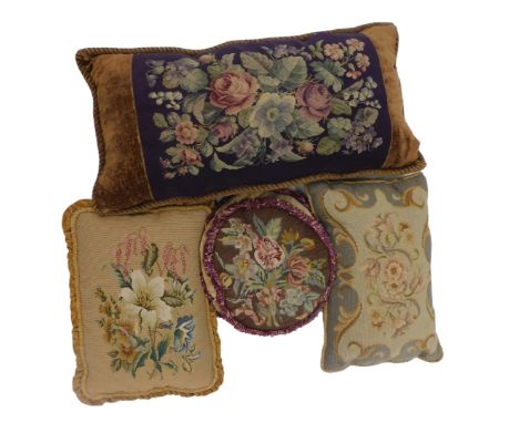 Four floral cushions, each with wool work tapestry covers. (4)