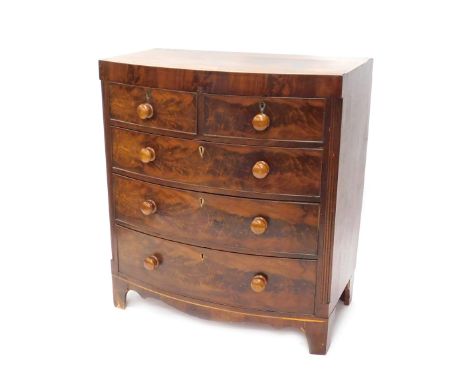 An early Victorian mahogany boxwood strung bow fronted chest of drawers, with a caddy top, above two short and three long dra