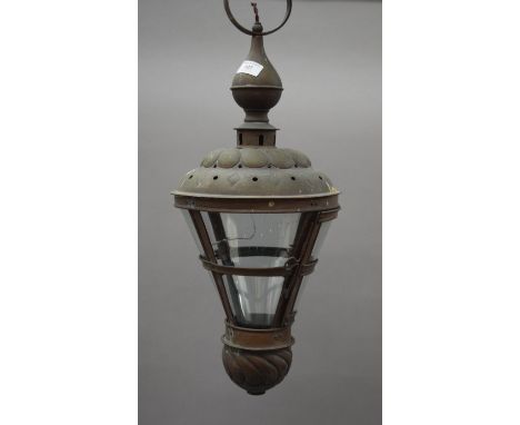 A brass hanging lantern. 64 cm high.
