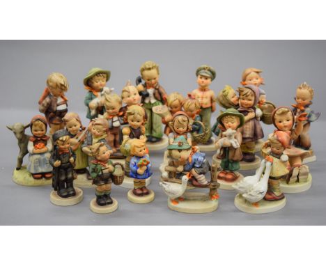 A collection of Hummel figures.