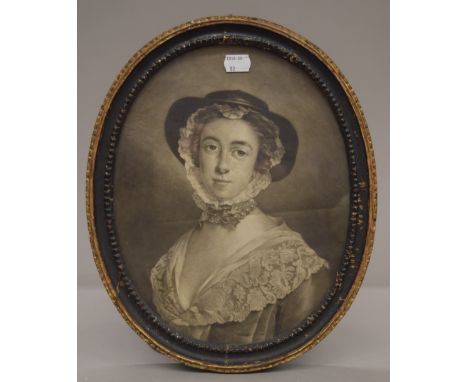 A 19th century print of a Young Lady in an oval carved wooden frame. 35 x 28 cm overall.