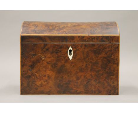 A 19th century burr yew wood tea caddy. 18 cm wide.