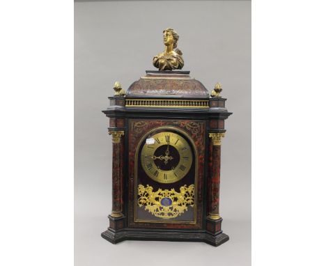 A Boulle bracket clock. 67 cm high.