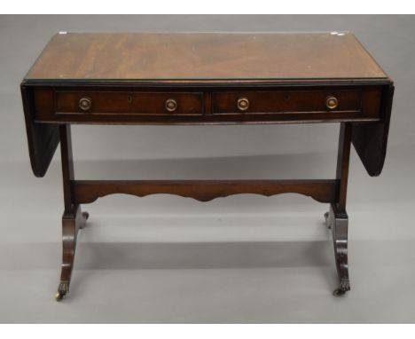 A late 19th/early 20th century mahogany sofa table. 107 cm wide flaps down.