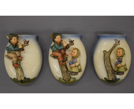 Three Hummel wall pockets. Each approximately 15 cm high.