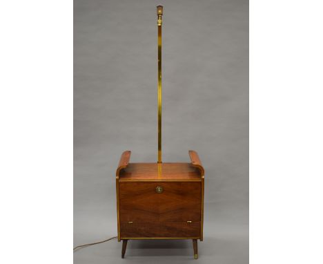 A mid-20th century cocktail cabinet with integral lamp. 178 cm high.