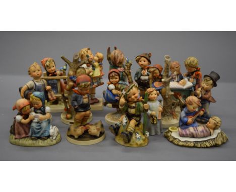 A collection of Hummel figures.