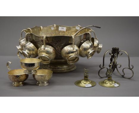 A silver plated punch bowl, ladle and cups; together with three silver plated bud vase bases. The punch bowl 32.5 cm diameter