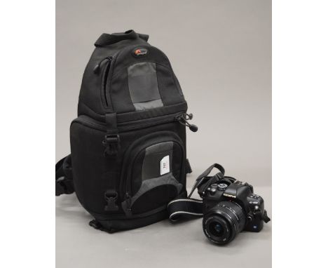 A cased Olympus digital camera.
