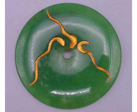 A jade roundel. 7.5 cm diameter.