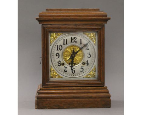 An Ansonia oak mantle clock. 24 cm wide.