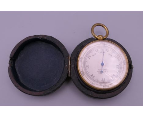 A Victorian leather cased pocket barometer.