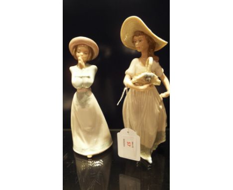 Two Nao figurines one girl with basket the other clasps hands together, marks to base  In good condition 