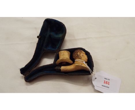 A vintage Meerschaum pipe of a carved colonial head and top hat with white metal band  Chip to hat and mouth piece missing