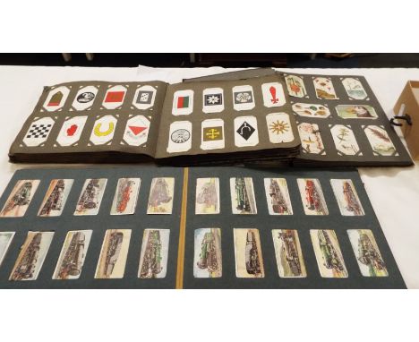 Three albums of vintage cigarette cards to include Cavanders 'Foreign Birds', John Players 'Army Corps and Divisional sign 19