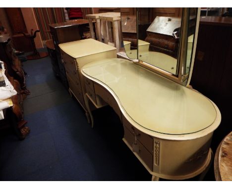 A cream painted dressing table with triple aspect mirror