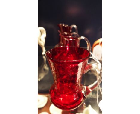 Four early 20thC ruby glass jugs