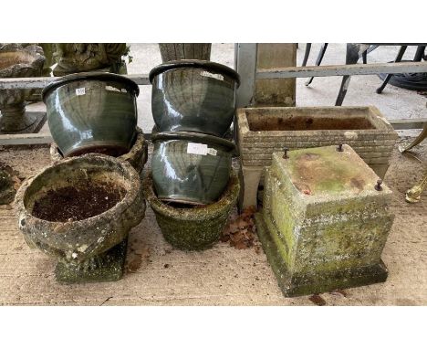 Four stone effect garden planters, various together with three green glazed planters, a trough and pedestal