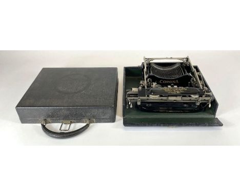 A Cornona portable typewriter, folding to fit into original case and with instructions and accessories