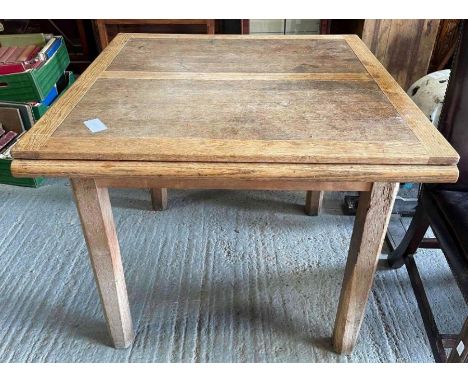 A light oak draw leaf table on square supports 156cm x 90.5cm extended together with a set of four stained wood dining chairs