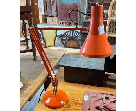 An orange anglepoise lamp