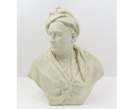 A Parian bust of a gentleman wearing cap and cloak, 29.5cm high