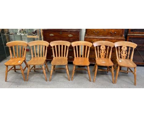 A set of six light wood Windsor chairs