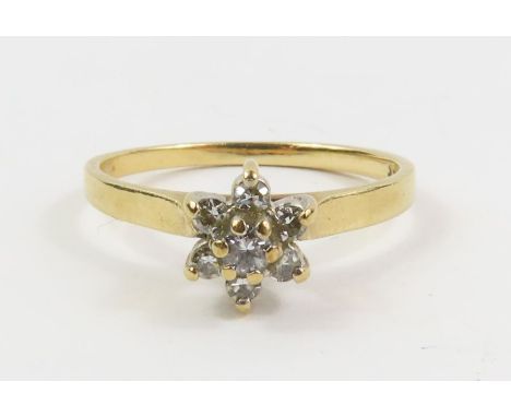 A small diamond cluster ring, marked '14k', finger size K 1/2, 1.84g gross