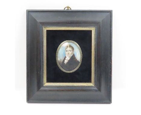 A 19th century ivory oval miniature portrait of a gentleman in later dark oak frame, miniature 6.5cm x 5cm - Ivory certificat