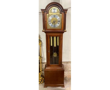 A reproduction longcase clock by Richard Broad, having arched brass dial with silvered chapter ring, three train movement and