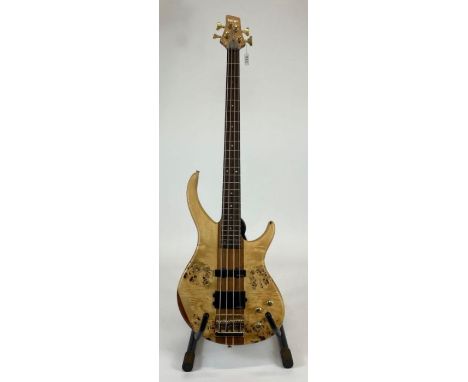 A Vintage electric bass guitar with satinwood pollarded wood front