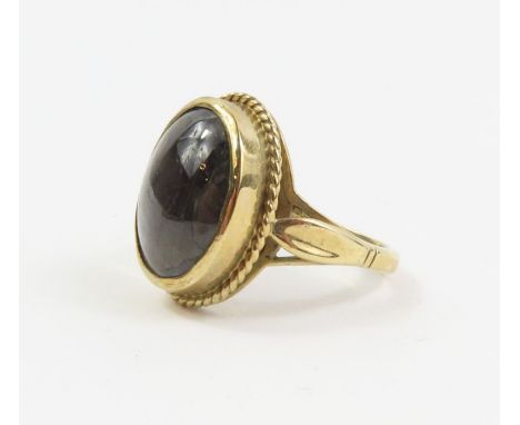 A 9ct gold black hardstone ring, finger size O 1/2, 6.97g gross