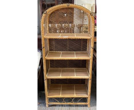 A woven cane arched free standing shelf unit, 149cm high 69cm wide 34cm deep