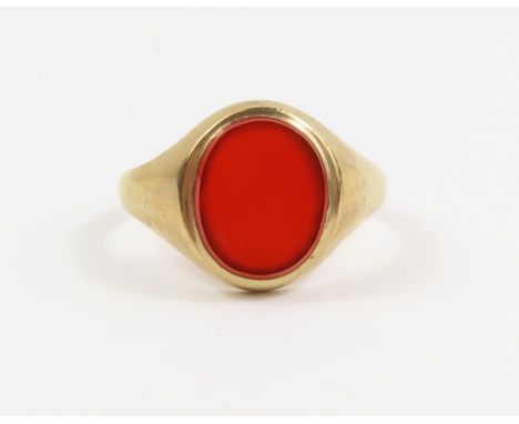 A 9ct gold signet ring set with an oval carnelian stone, finger size V 1/2, 4.15g gross