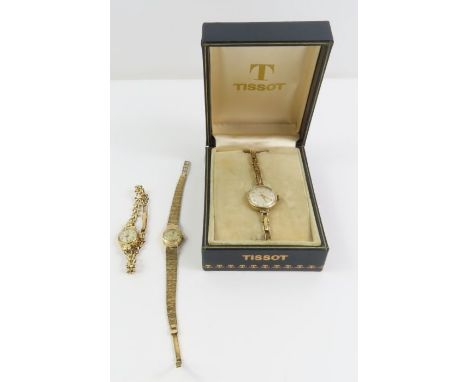 A ladies 9ct gold Tissot wristwatch on bracelet, with associated box; a ladies 9ct gold Rotary wristwatch on bracelet and a l