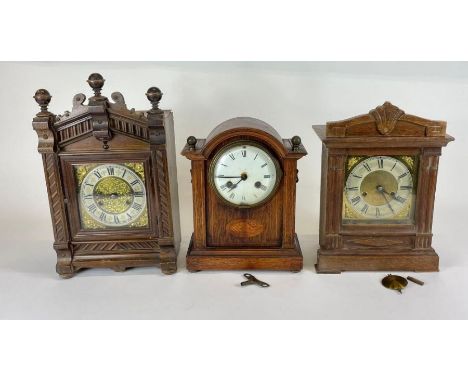 Three Victorian mantel clocks in wooden architectural cases