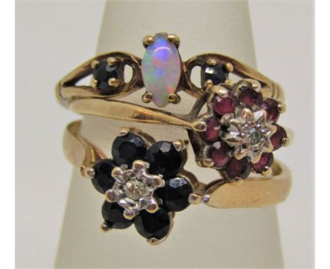 Three 9ct gem set dress rings; two floral clusters each set centrally with a diamond and one set with an opal, 4.5g total (3)