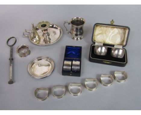 Set of six engine turned demi-lune silver napkin rings, numbered 1 - 6, together with a further cased set of Bakelite and sil