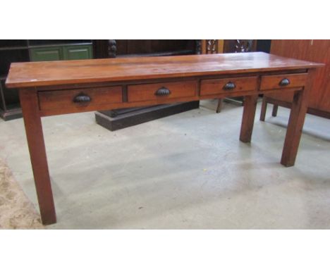 A vintage pine side table, fitted with four frieze drawers, raised on square cut supports, beneath a stained beechwood top, 6