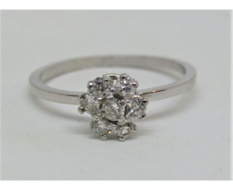 Diamond cluster ring in unmarked white metal, size M/N, 2.1g